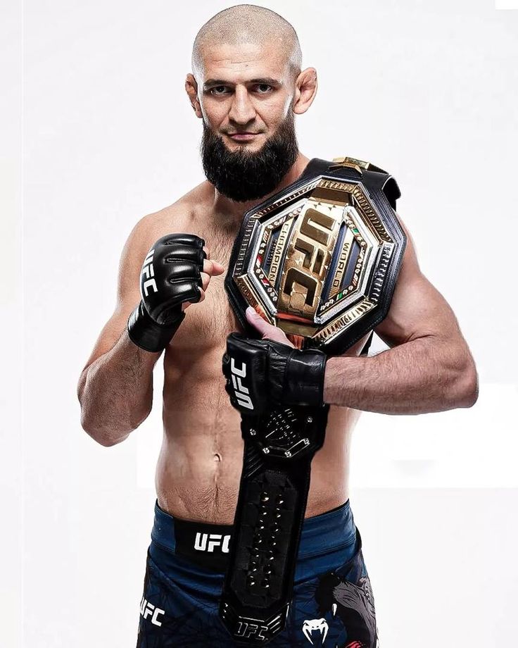 Khamzat Chimaev — UFC Middleweight Champion holding his title belt