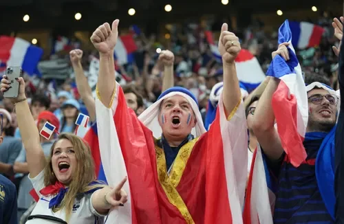 World Cup 2026 fans celebrating a goal in a packed stadium